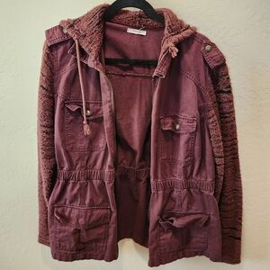 Maurice's rust colored jacket